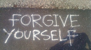 Forgive yourself written on a sidewalk