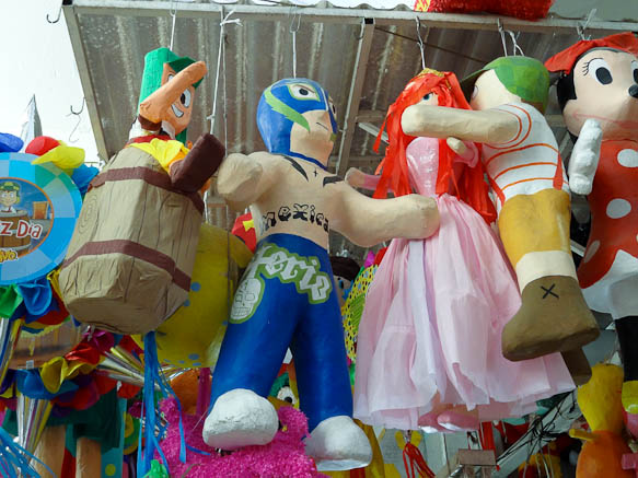 pinatas of luchadors in central market of san luis potosi
