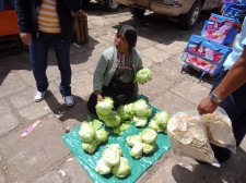 Woman Selling Lettuce On The Street