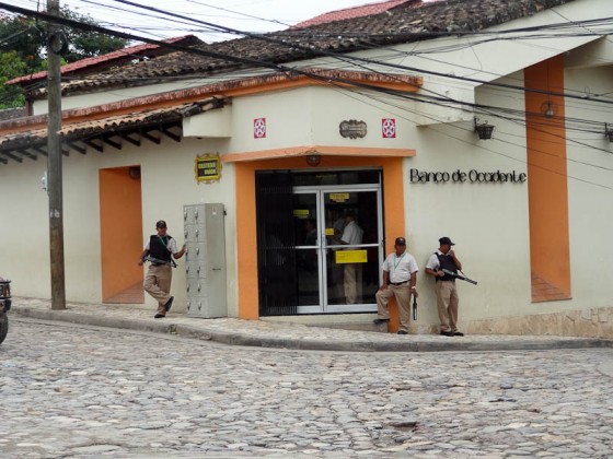 Armed Guards Guarding A Bank