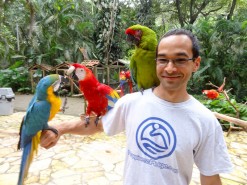 Me with birds at Macaw Mountain Bird Park In Copan Ruinas Honduras
