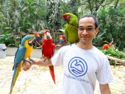 Me with birds at Macaw Mountain Bird Park In Copan Ruinas Honduras