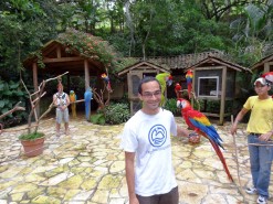 Me with birds at Macaw Mountain Bird Park In Copan Ruinas Honduras