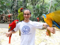 Me with birds at Macaw Mountain Bird Park In Copan Ruinas Honduras