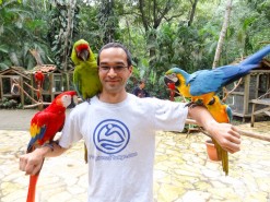 Me with birds at Macaw Mountain Bird Park In Copan Ruinas Honduras