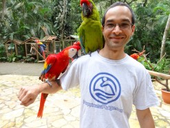 Me with birds at Macaw Mountain Bird Park In Copan Ruinas Honduras