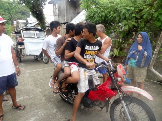 four people on one motorcycle