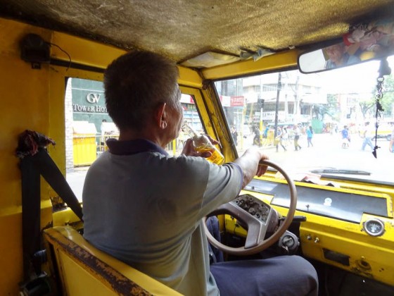 jeepney driver drinking beer and driving