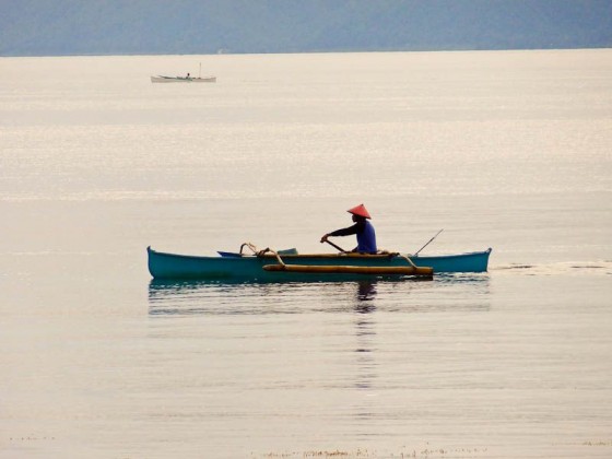 man in a boat at sea