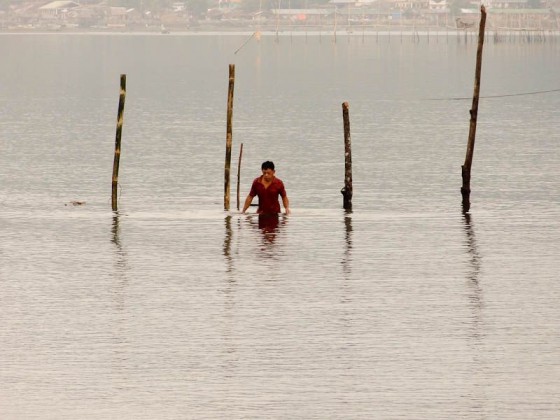 man walking in the sea