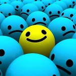 be different be happy yellow smiley in middle of sad blue smileys