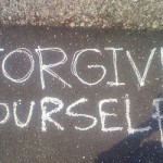 Forgive yourself written on a sidewalk