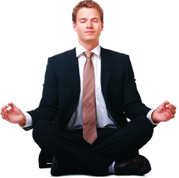 man in business suit doing yoga