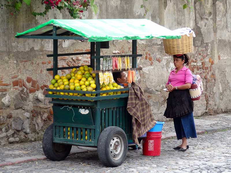 Fruit Stand With Yellow/Green Oranges