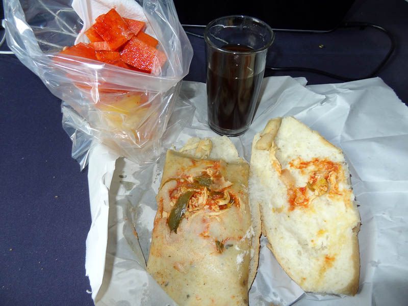 Breakfast Tamale On Bread With A Cup Of Fruit And Coffee