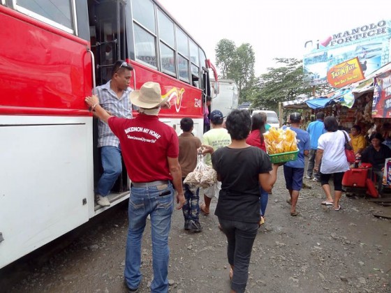 Vendors Descending On A Stopped Bus Vendors Descending On A Stopped Bus
