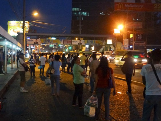 People Waiting For Jeepneys On The Side Of The Road People Waiting For Jeepneys On The Side Of The Road
